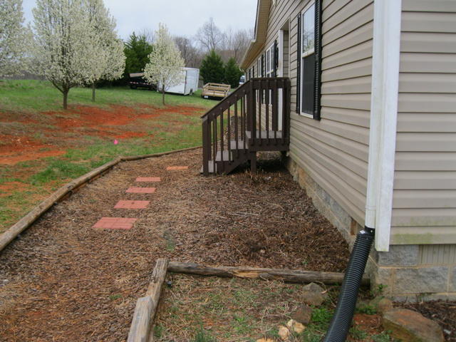 1064 Parrish Road Goodview, VA 24095 - Photo 20 of 21 a view of a house with backyard and trees