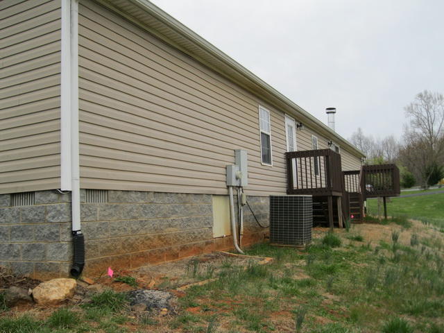 1064 Parrish Road Goodview, VA 24095 - Photo 4 of 21 a house view with a backyard space