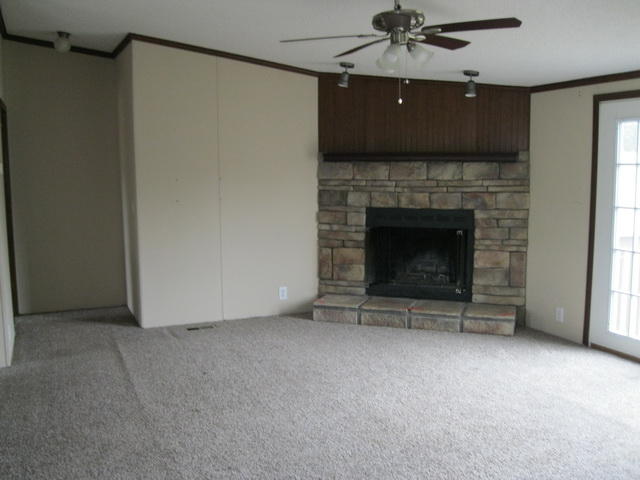 1064 Parrish Road Goodview, VA 24095 - Photo 7 of 21 a living room with a fireplace