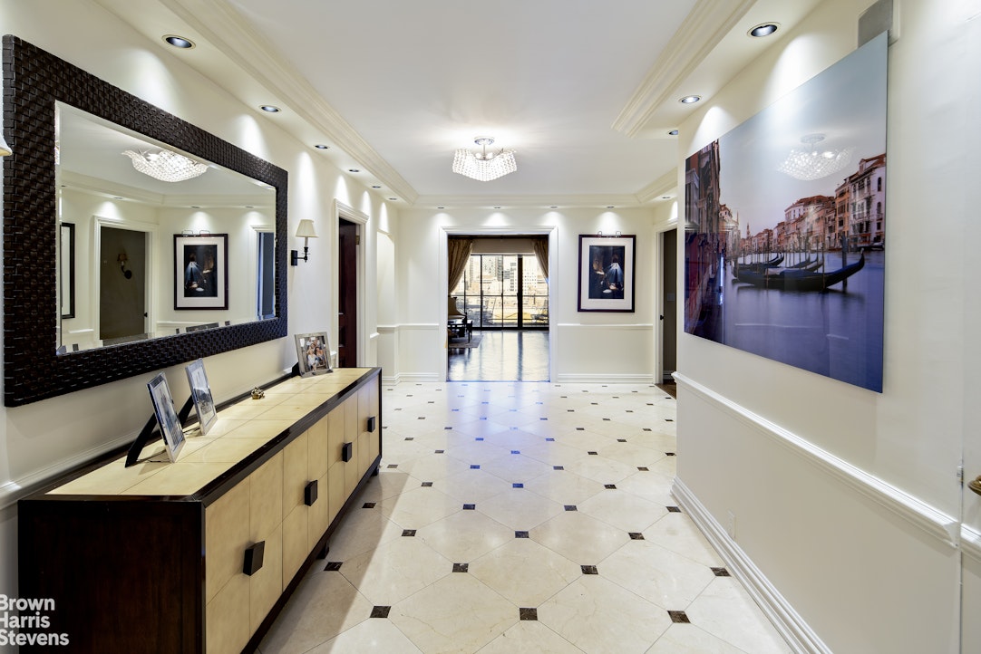 a bathroom with a sink mirror and shower