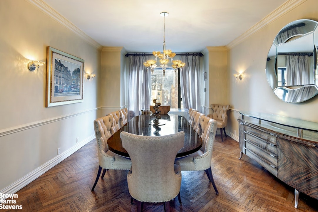 425 East 58th Street, Unit 16A Manhattan, NY 10022 - Photo 5 of 12 a dining room with furniture a chandelier and wooden floor