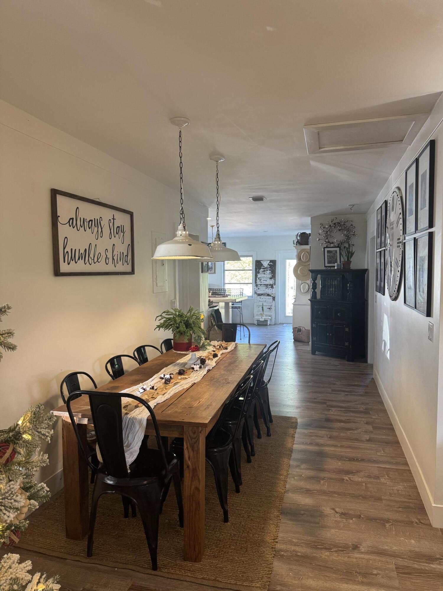 8933 Southeast Ceres Street Hobe Sound, FL 33455 - Photo 4 of 5 a view of a dining room with furniture