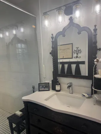 a bathroom with a sink and a mirror