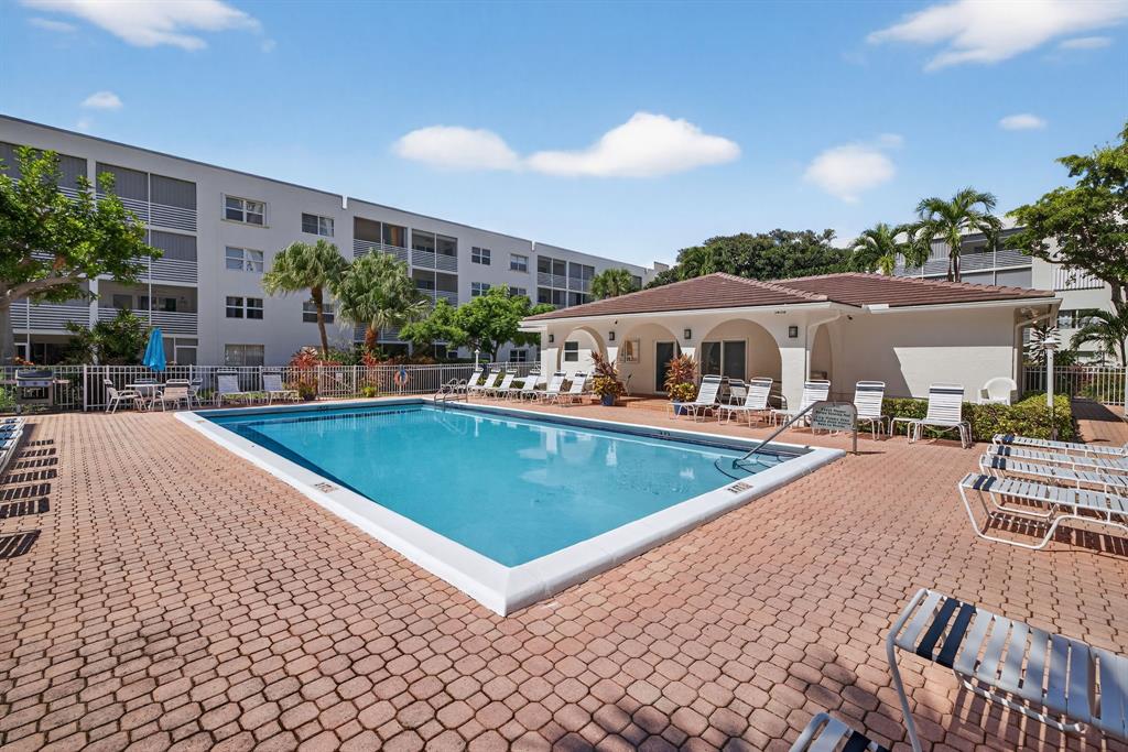 1541 South Ocean Boulevard, Unit 405 Lauderdale-by-the-Sea, FL 33062 - Photo 31 of 57 a view of a house with swimming pool