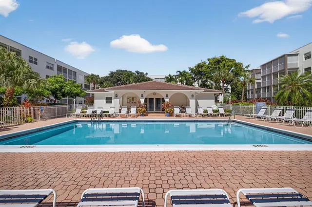 a living room with lots of furniture and a chandelier