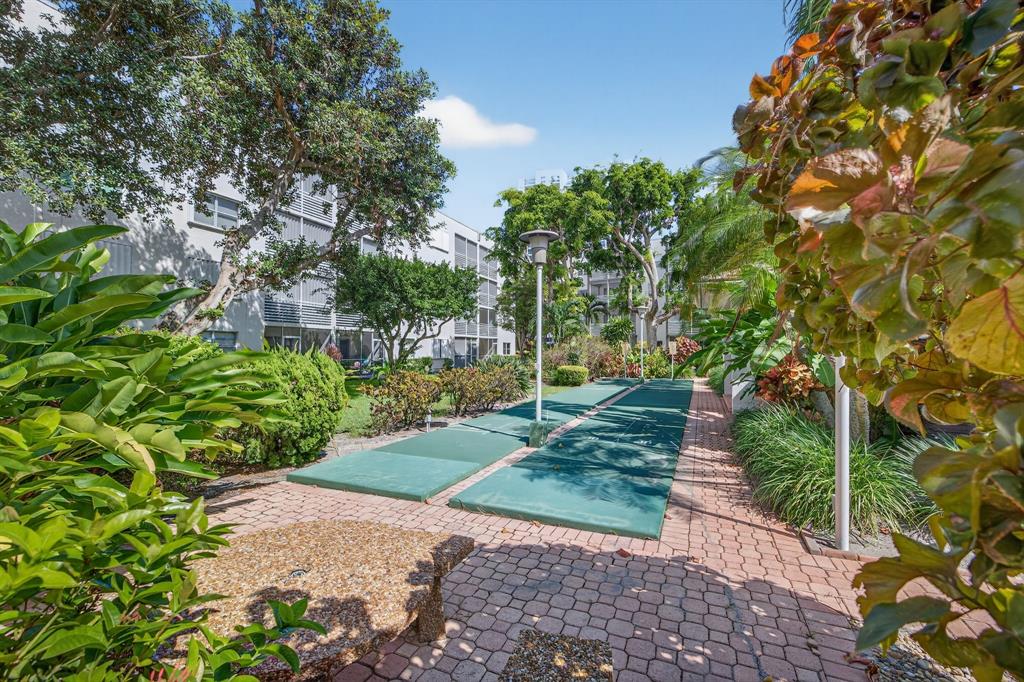 1541 South Ocean Boulevard, Unit 405 Lauderdale-by-the-Sea, FL 33062 - Photo 36 of 57 a view of a park with plants and large trees