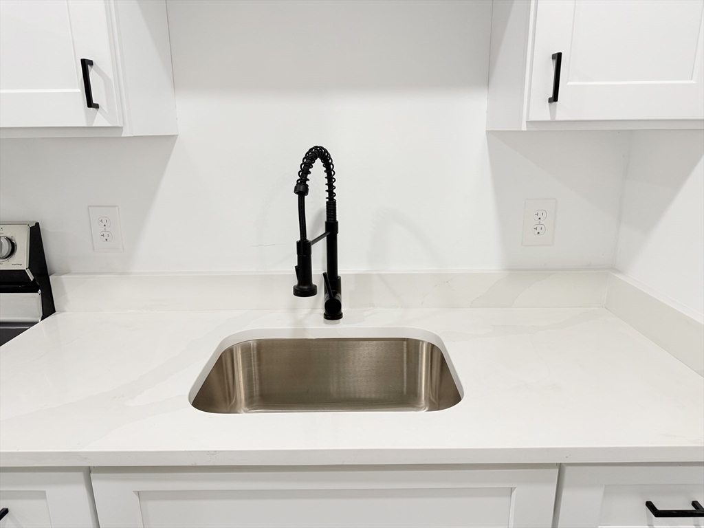 23 Bellevue Street, Unit 2 Worcester, MA 01609 - Photo 8 of 19 a close view of sink and tap