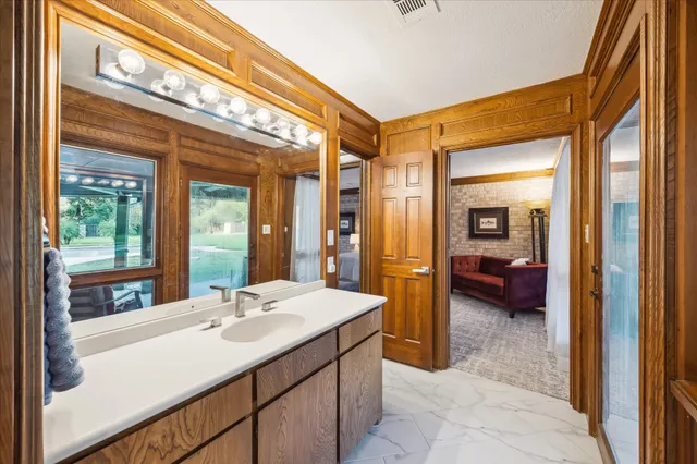 a spacious bedroom with a bed and a couch