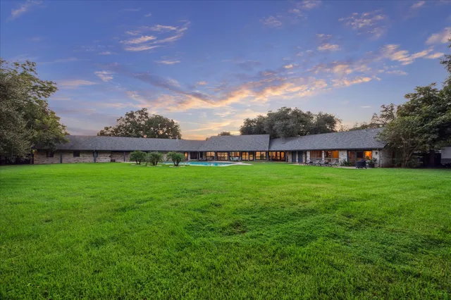 a view of a house with a big yard