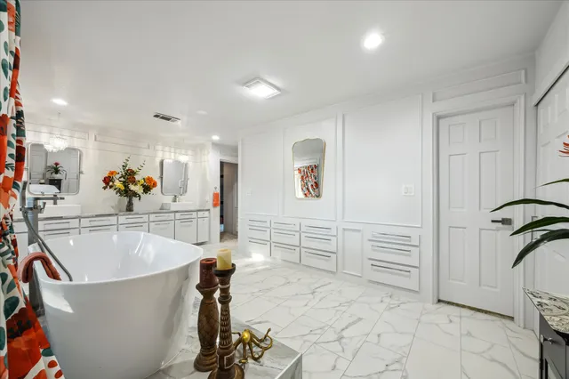 a bedroom with a bed furniture and a window