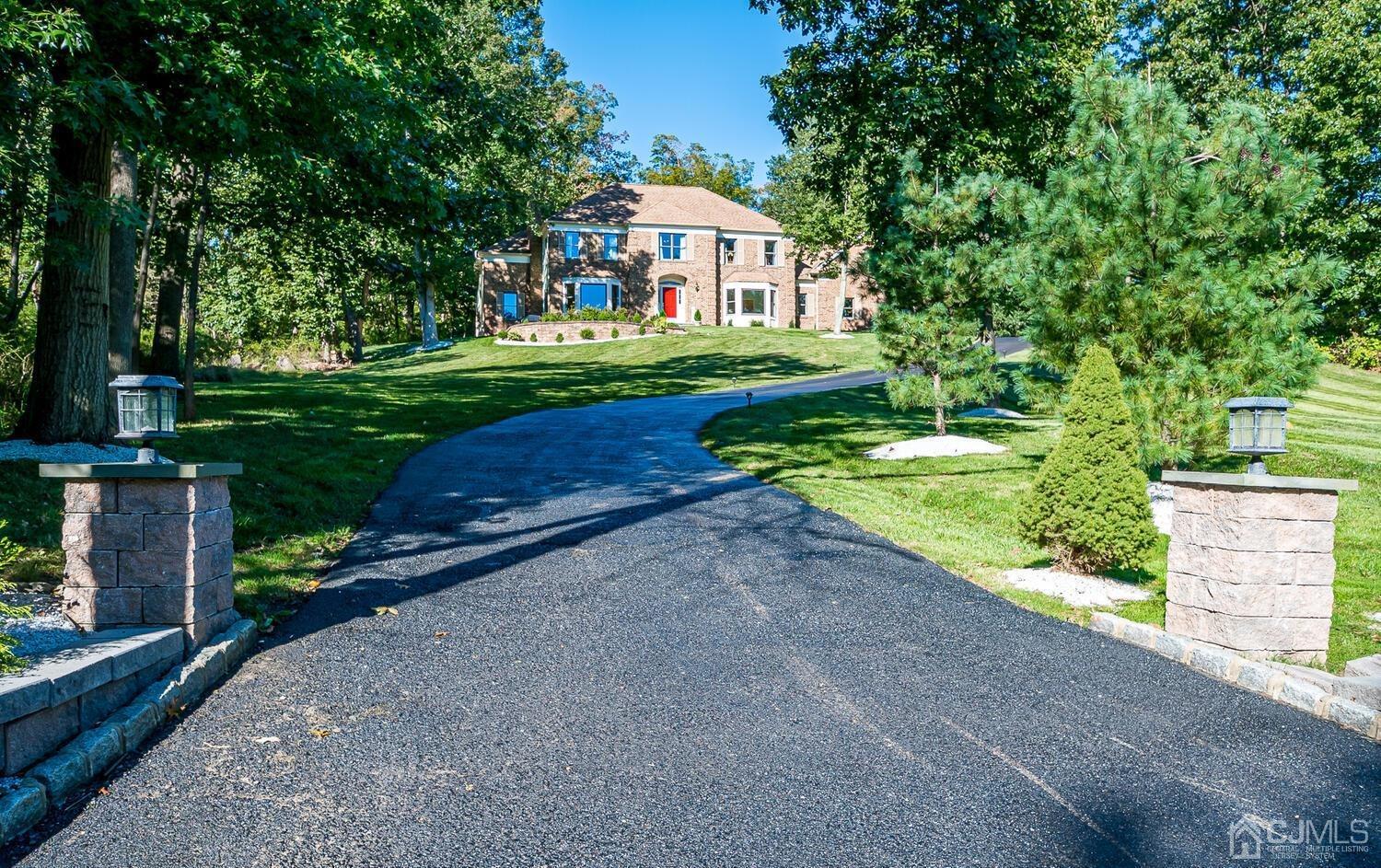 39 Martinsville Road Bernards, NJ 07920 - Photo 1 of 65 a front view of a house with a yard and green space