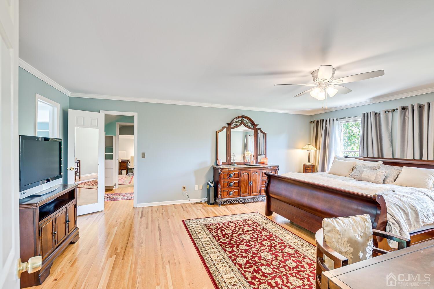 39 Martinsville Road Bernards, NJ 07920 - Photo 34 of 65 a bedroom with furniture and a flat screen tv