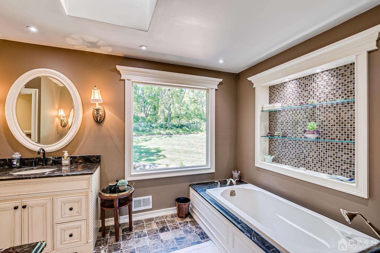 39 Martinsville Road Bernards, NJ 07920 - Photo 36 of 65 a bathroom with a large tub sink and mirror