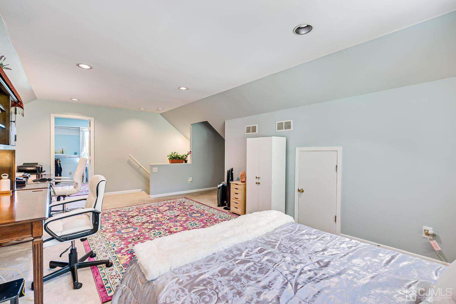 39 Martinsville Road Bernards, NJ 07920 - Photo 41 of 65 a bedroom with a bed and dresser with mirror