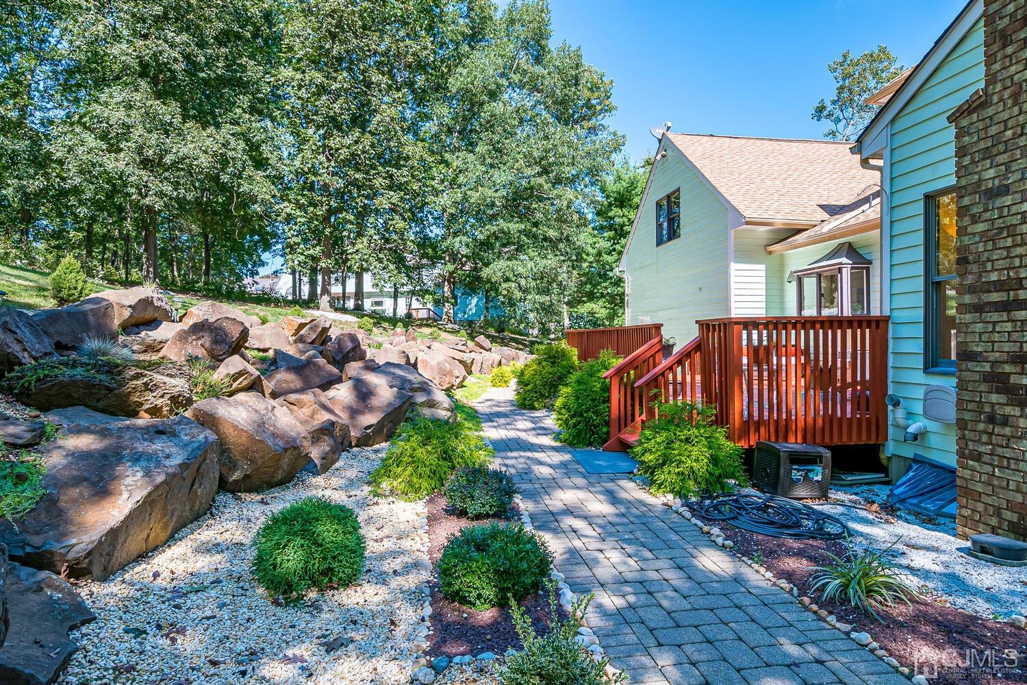 39 Martinsville Road Bernards, NJ 07920 - Photo 61 of 65 a front view of a house with garden
