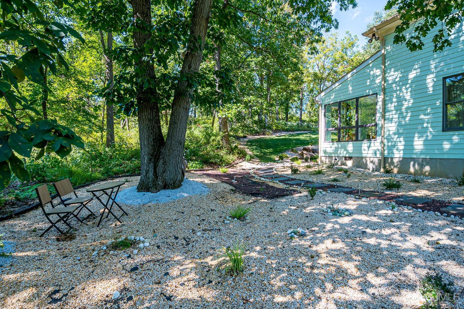 39 Martinsville Road Bernards, NJ 07920 - Photo 62 of 65 a view of a patio with table and chairs under an umbrella