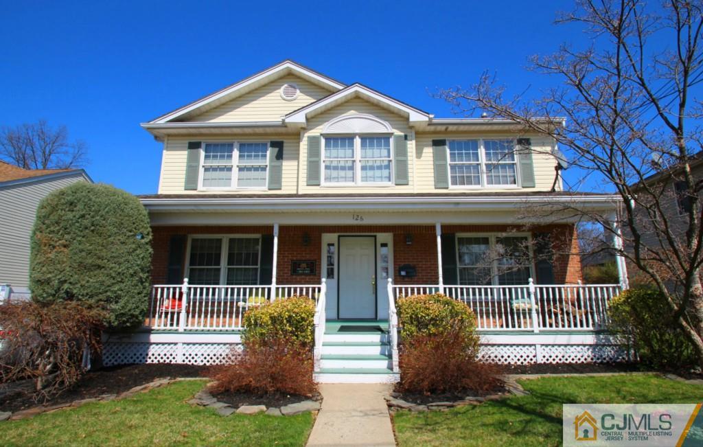 126 North Hill Road Colonia, NJ 07067 - Photo 1 of 25 a front view of a house with yard
