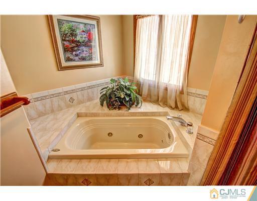 126 North Hill Road Colonia, NJ 07067 - Photo 16 of 25 a bathroom with a tub