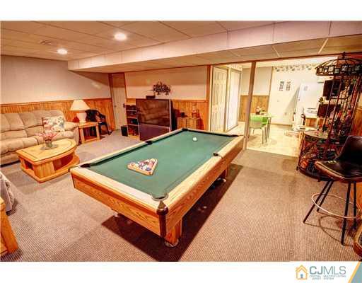 126 North Hill Road Colonia, NJ 07067 - Photo 22 of 25 a room with pool table and glass windows