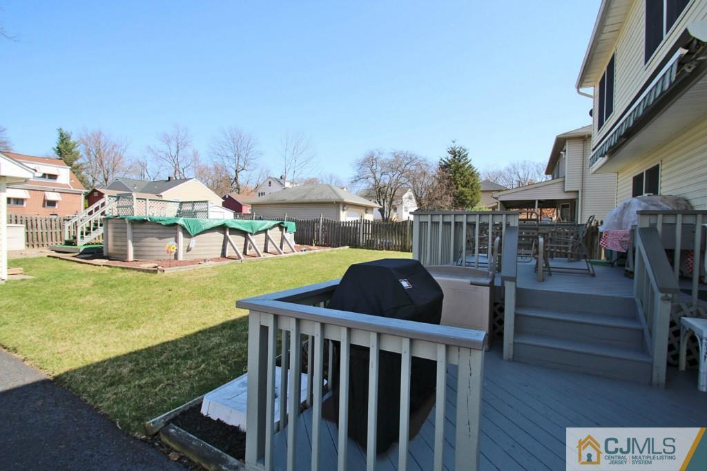 126 North Hill Road Colonia, NJ 07067 - Photo 24 of 25 a view of a patio with a table and chairs