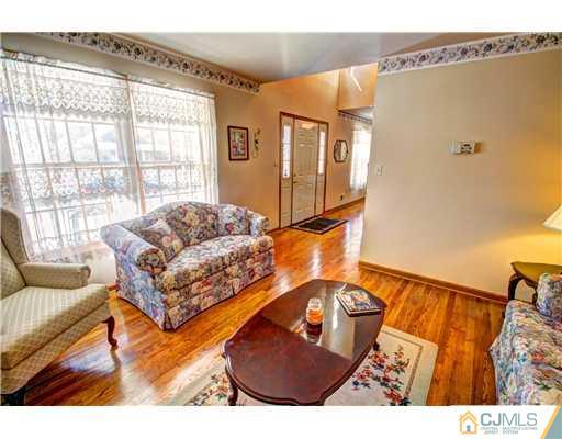 126 North Hill Road Colonia, NJ 07067 - Photo 5 of 25 a living room with furniture and a window