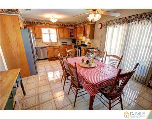 126 North Hill Road Colonia, NJ 07067 - Photo 7 of 25 a view of a dining room with furniture and wooden floor