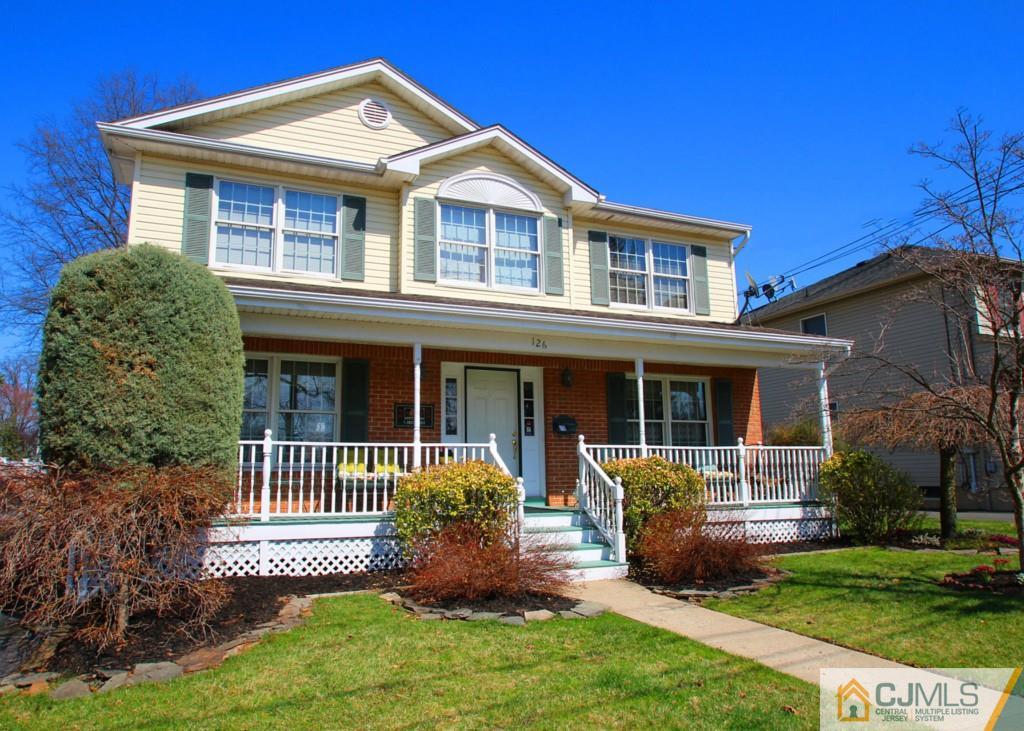 126 North Hill Road Colonia, NJ 07067 - Photo 9 of 25 a front view of a house with a yard