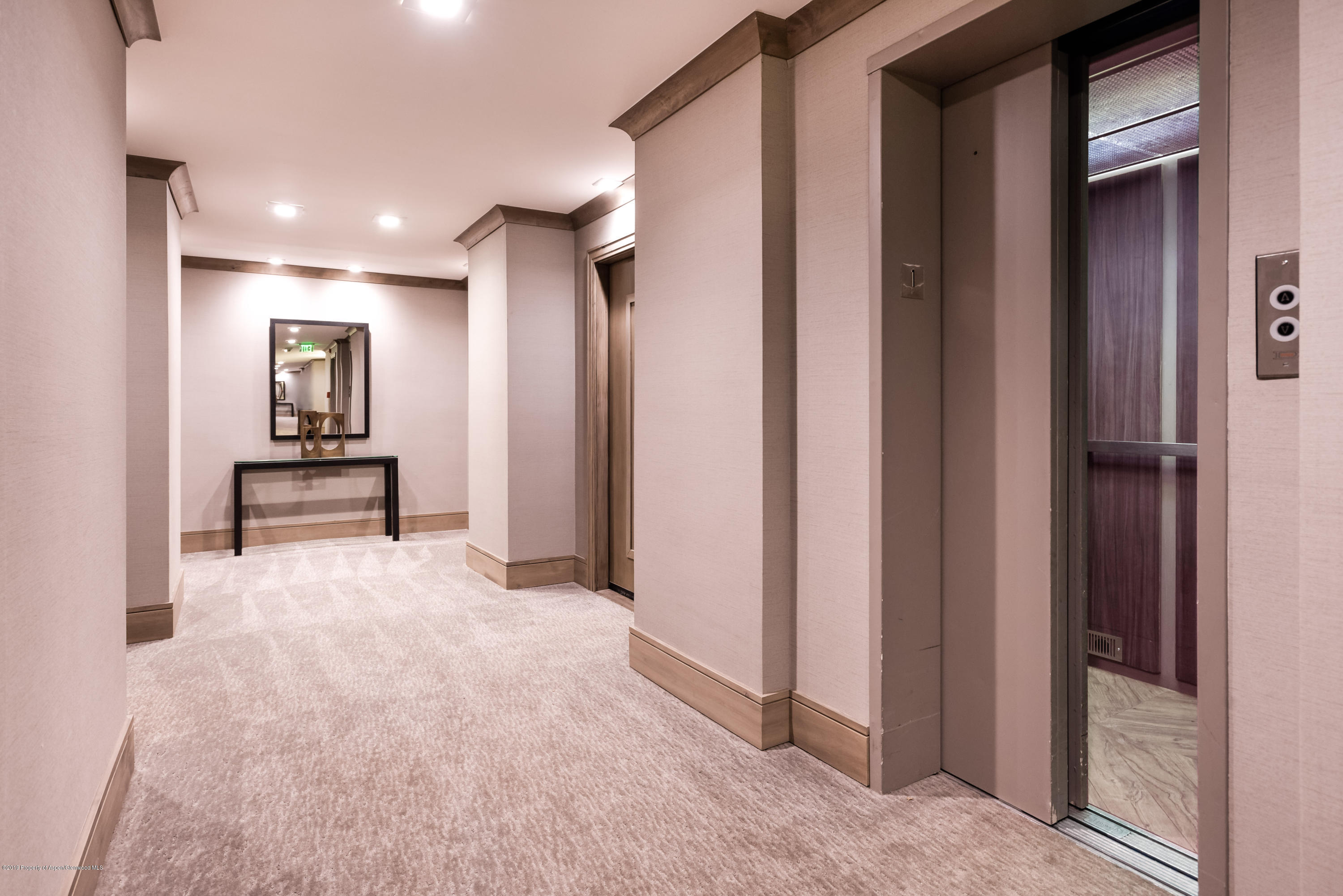205 East Durant Avenue, Unit 3F Aspen, CO 81611 - Photo 12 of 20 a view of hallway with stairs and furniture
