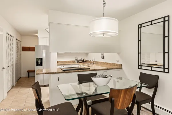 a kitchen that has a cabinets and a stove in it