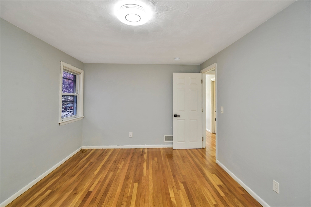 16 Prospect Street Boston, MA 02136 - Photo 14 of 37 an empty room with wooden floor