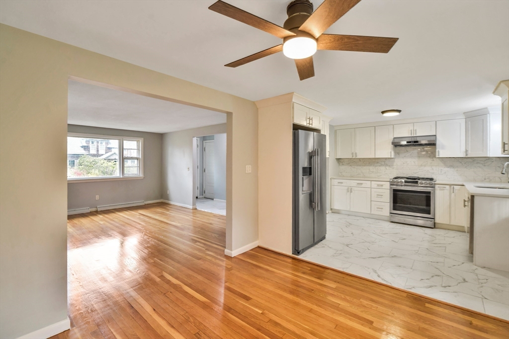 16 Prospect Street Boston, MA 02136 - Photo 21 of 37 a view of a kitchen with wooden floor a sink a refrigerator and window