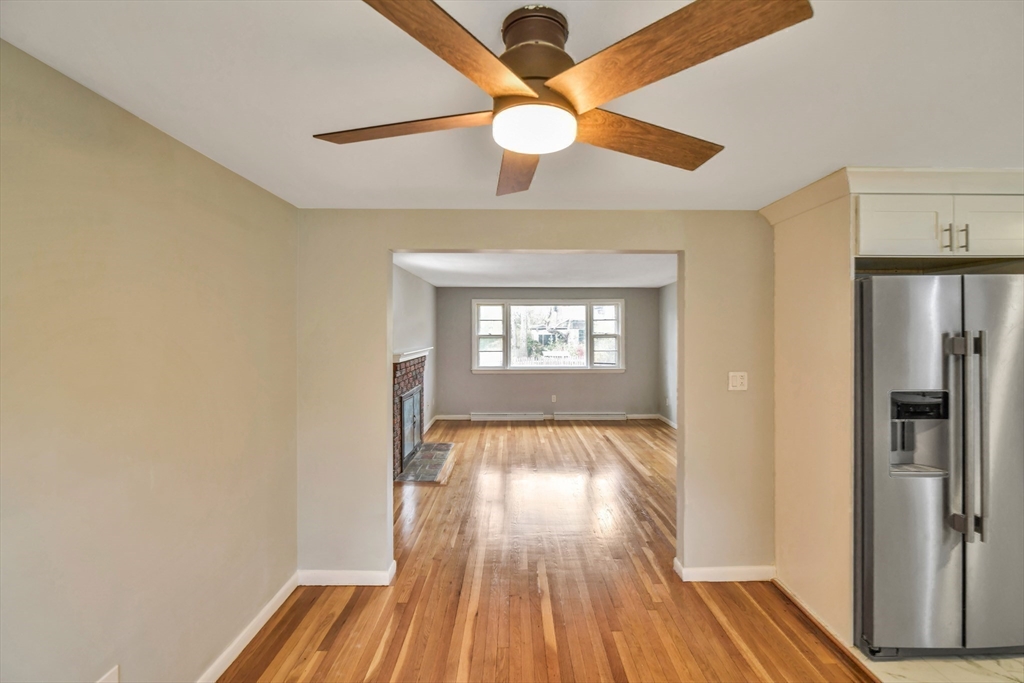 16 Prospect Street Boston, MA 02136 - Photo 22 of 37 a view of an empty room with window and wooden floor