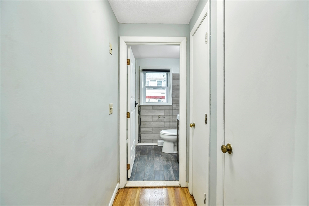16 Prospect Street Boston, MA 02136 - Photo 27 of 37 a view of a bathroom from a hallway