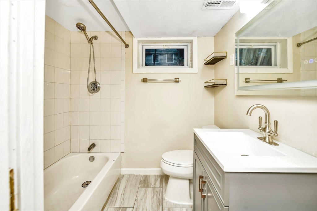 16 Prospect Street Boston, MA 02136 - Photo 36 of 37 a bathroom with a sink a toilet and shower