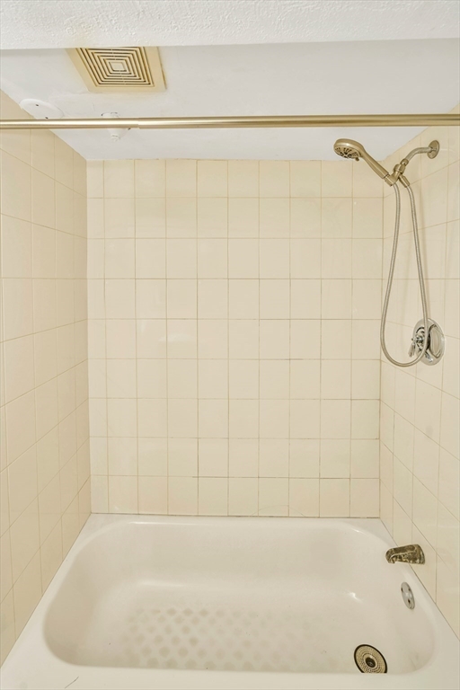 16 Prospect Street Boston, MA 02136 - Photo 37 of 37 a bathroom with a shower and a bathtub