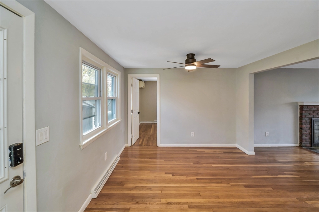 16 Prospect Street Boston, MA 02136 - Photo 8 of 37 a view of a livingroom with wooden floor and a ceiling fan