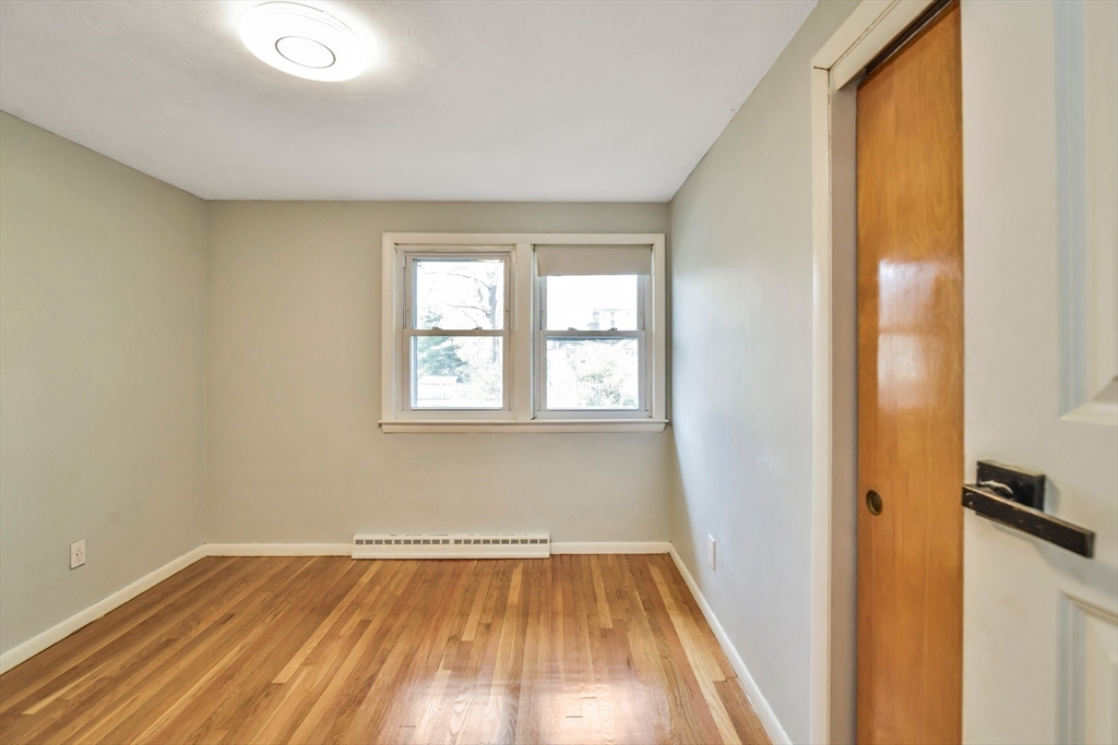 16 Prospect Street Boston, MA 02136 - Photo 9 of 37 an empty room with wooden floor and windows