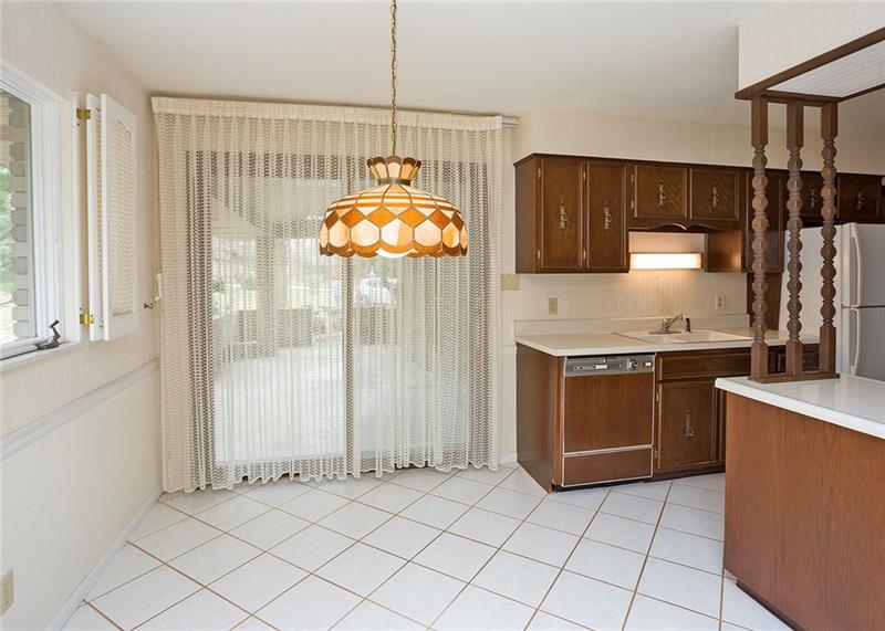 150 Crouse Road Greensburg, PA 15601 - Photo 11 of 25 EAT-IN KITCHEN WITH SLIDING GLASS DOORS LEADING TO THE CONCRETE COVERED PATIO.