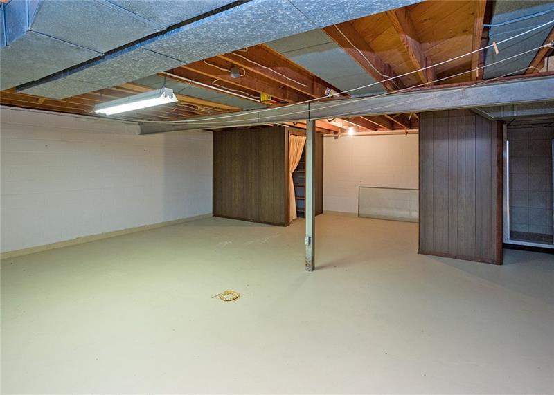 150 Crouse Road Greensburg, PA 15601 - Photo 18 of 25 35 X 25 BASEMENT AREA WITH STEPS LEADING TO GARAGE AND FULL BATH.