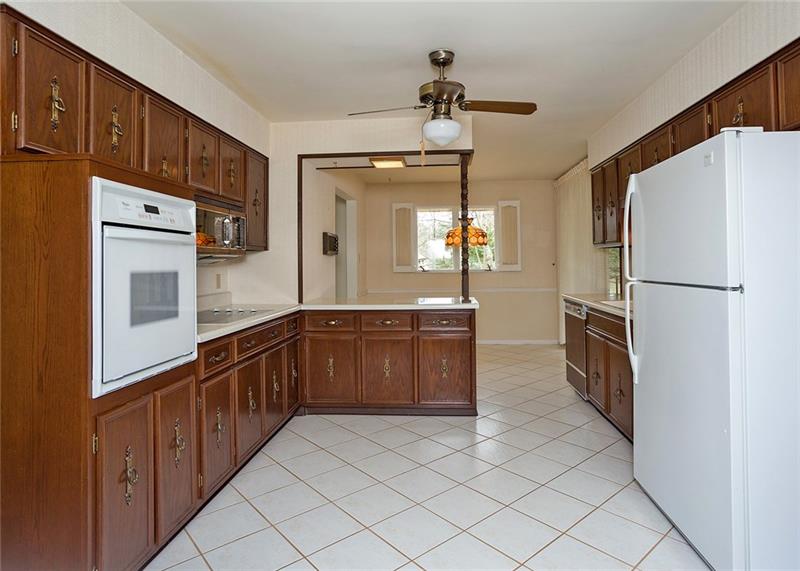 150 Crouse Road Greensburg, PA 15601 - Photo 8 of 25 THE FULLY EQUIPPED KITCHEN OFFERS TONS OF CABINETS AND COUNTER SPACE.