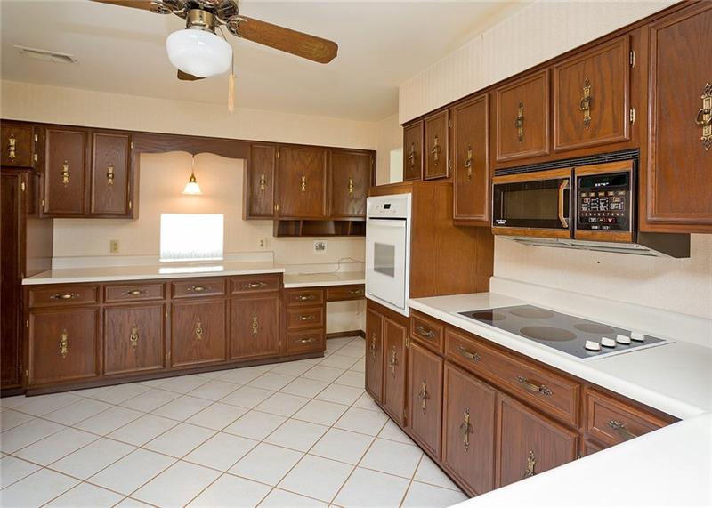 150 Crouse Road Greensburg, PA 15601 - Photo 9 of 25 STORAGE WON'T BE A PROBLEM IN THIS KITCHEN WITH THE ABUNDANCE OF CABINETS AND PANTRY.