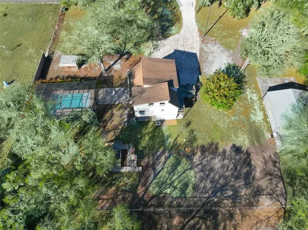 an aerial view of house with yard