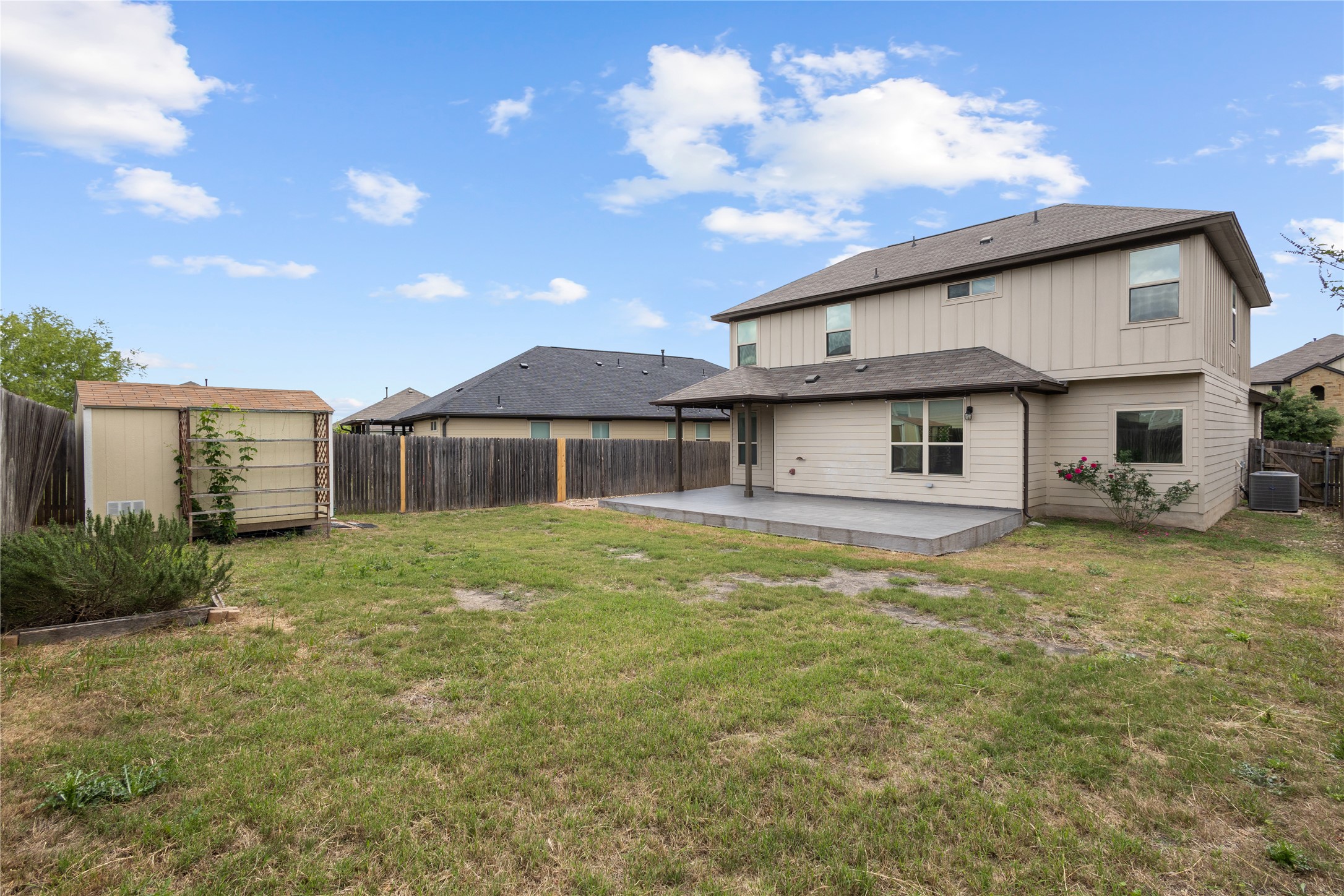 397 Limerick Road Buda, TX 78610 - Photo 30 of 33 The fully-fenced backyard offers a convenient storage shed and plenty of room to run and play.