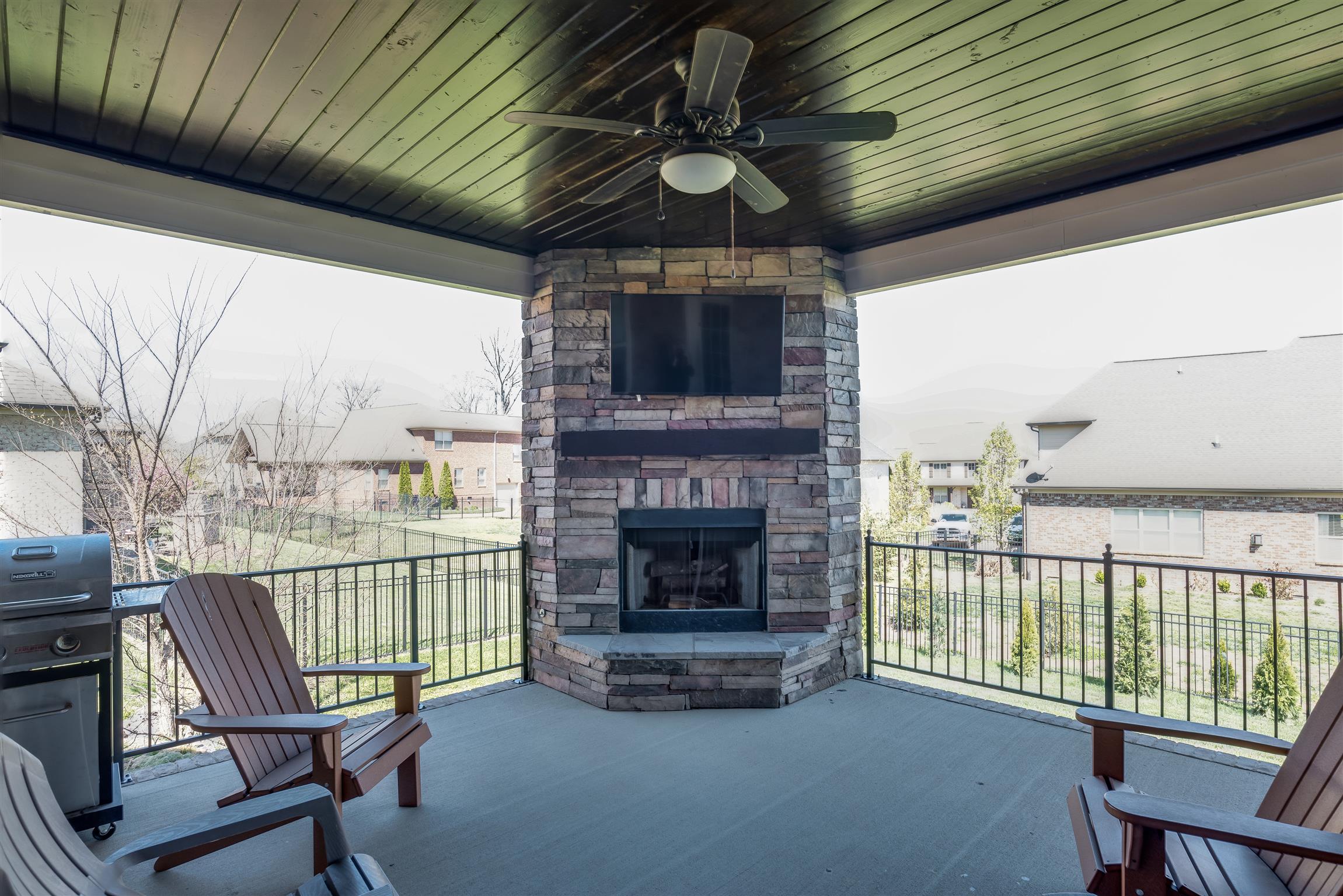 2072 Autumn Ridge Way Spring Hill, TN 37174 - Photo 28 of 30 Covered Back Porch w/ Mantle and Fireplace! Wood ceiling w/ Fan and Entertainment area above FP.