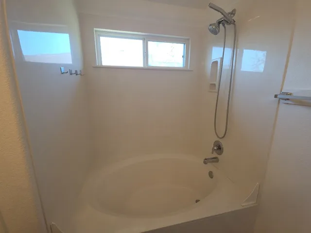 a bathroom with a bathtub
