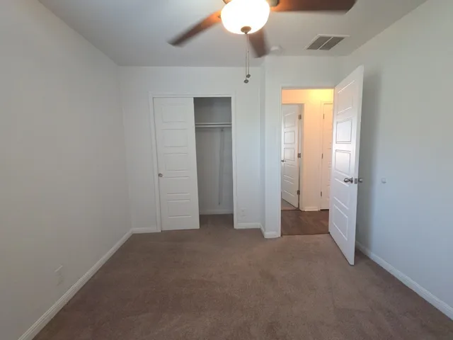 an empty room with a bathroom