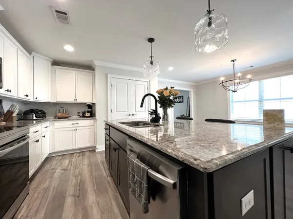 a spacious bedroom with a bed and a walk in closet