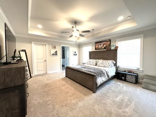 a bathroom with a granite countertop sink mirror and shower