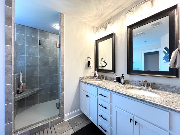 a bath tub sitting in a bathroom next to a window
