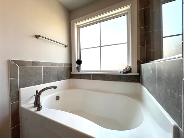 a bathroom with a bathtub and shower